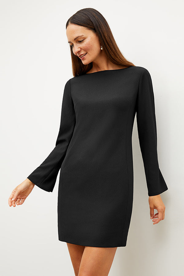 Front image of a woman wearing the regina dress in black | Exclude