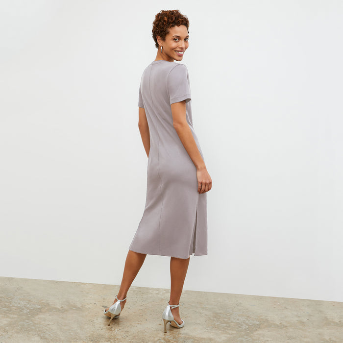back image of a woman wearing the renee dress in wisteria