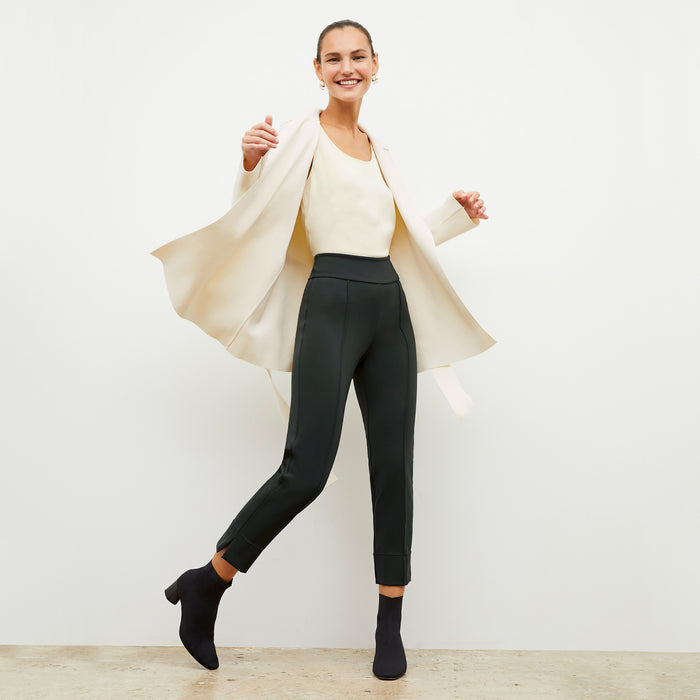 Front image of a woman wearing the robin pant in forest