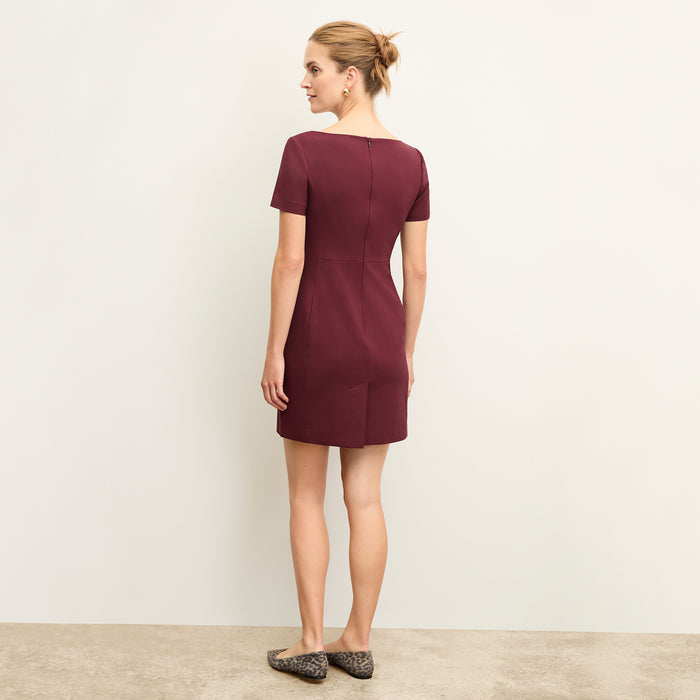 back image of a woman wearing the rosie dress in shiraz