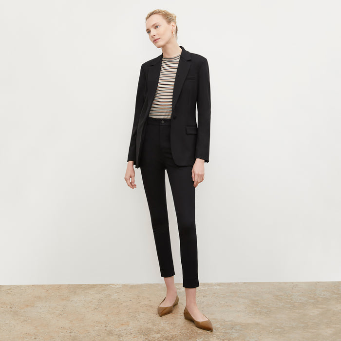 Front image of a woman wearing the Rowan flat in Cognac