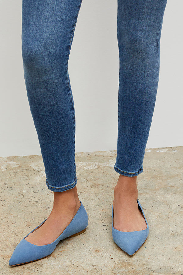 Woman standing wearing the Rowan flat in Sky Blue | Grid Hover | Exclude