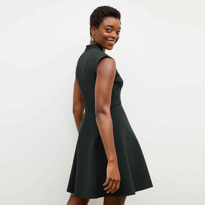Back image of a woman wearing the ruth dress in forest