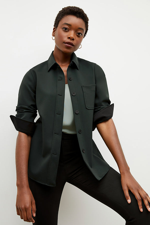 Front image of a woman wearing the sierra shacket in forest | Exclude | Grid