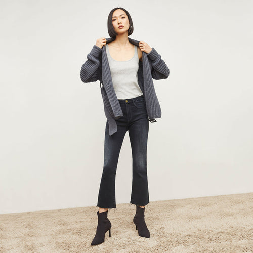 Front image of a woman standing wearing the FRAME Denim Le Crop Slim Bootcut Raw Edge Jean in Marcella | Lead