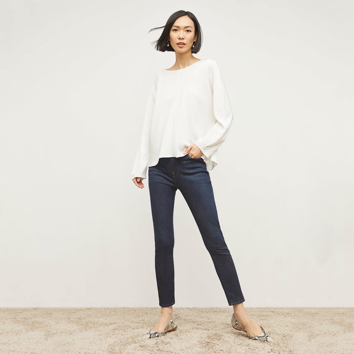 Front image of a woman standing wearing the FRAME Denim Le High Skinny Crop Jean in Samira | Lead