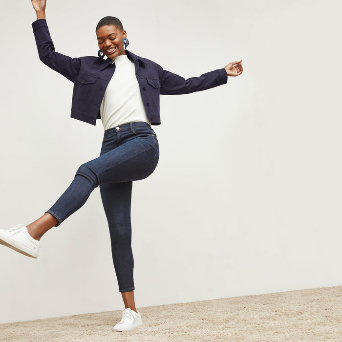 Side image of a woman standing wearing the FRAME Denim Le High Skinny Crop Jean in Samira