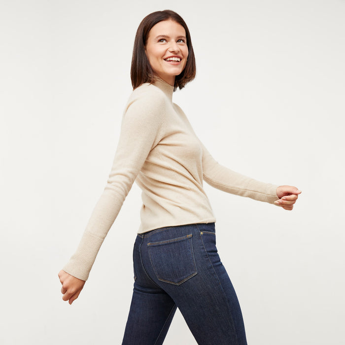 Back image of a woman standing wearing the FRAME Denim Le High Skinny Crop Jean in Samira