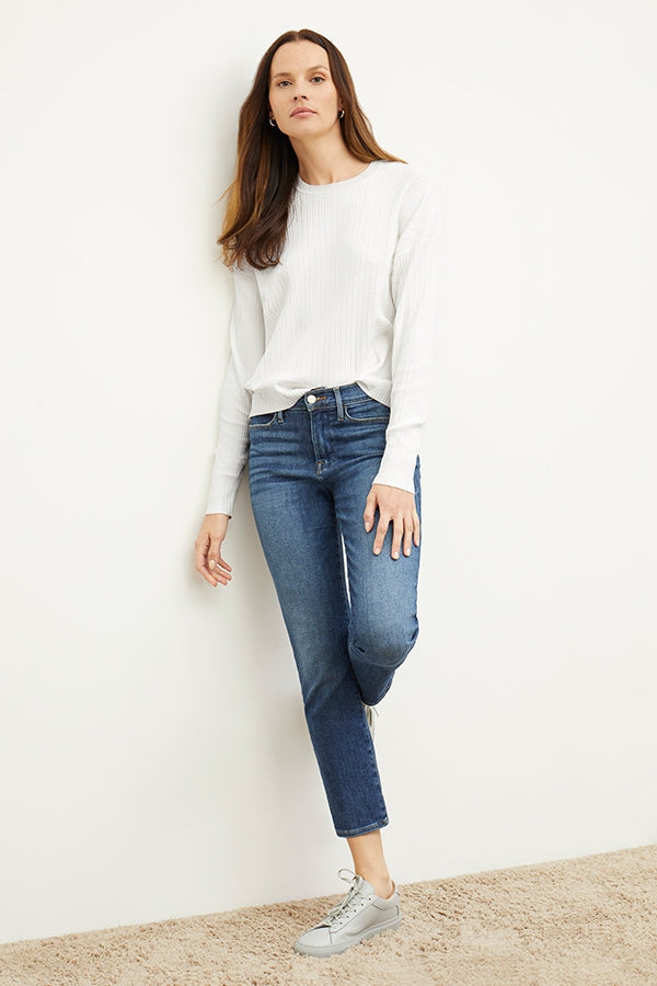 Front image of a woman standing wearing the FRAME Denim Le High Straight in Bestia | Grid | Exclude