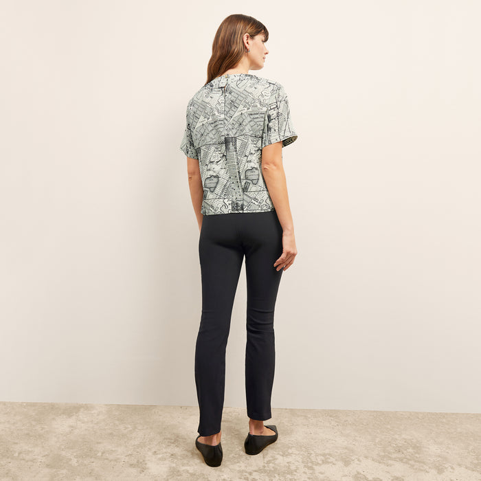 back image of a woman wearing the Foster Skinny Pant in Black