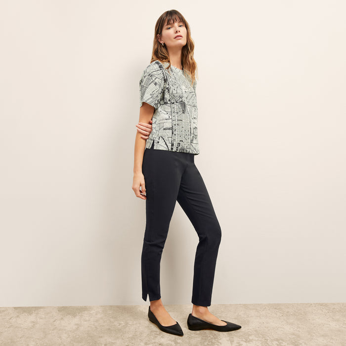 Front image of a woman wearing the Foster Skinny Pant in Black
