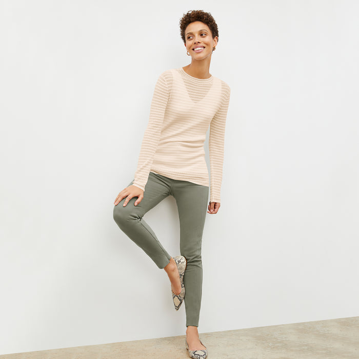 Front image of a woman wearing the skinny foster in thyme | Lead
