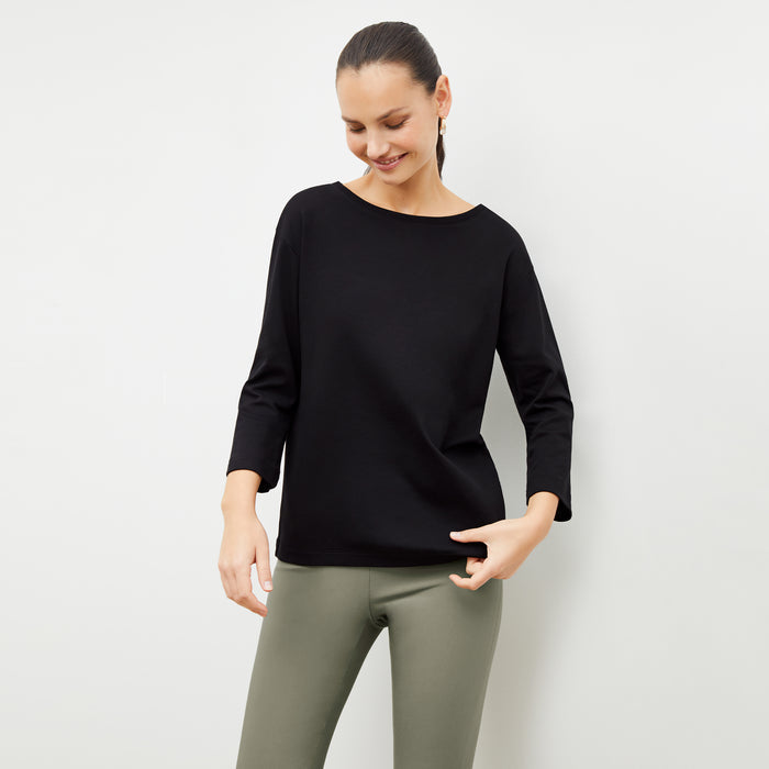 Front image of a woman wearing the skinny foster in thyme