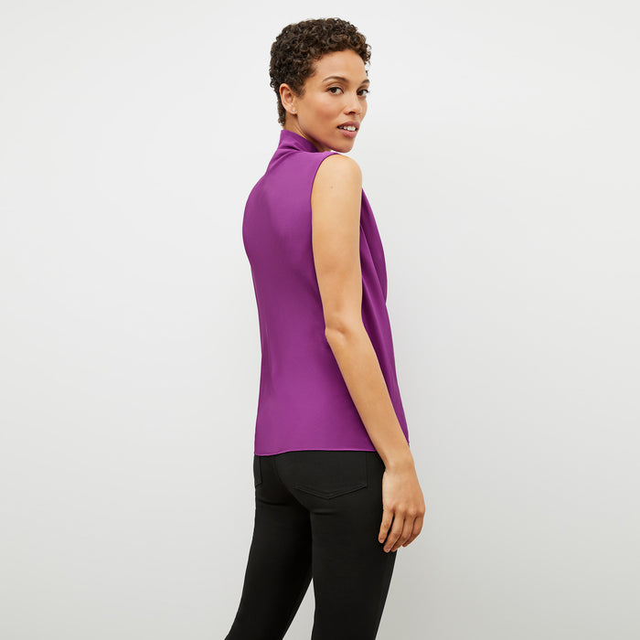 Back image of a woman wearing the Sloane top in purple jasper