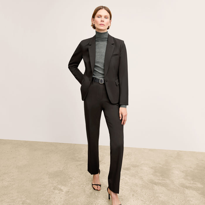 Front image of a woman wearing the smith pant in black