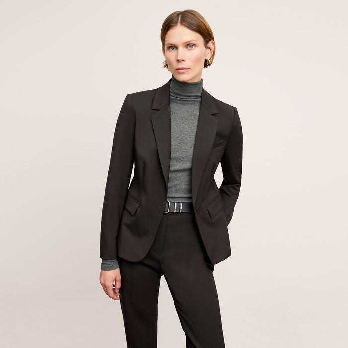 Front image of a woman wearing the smith pant in black