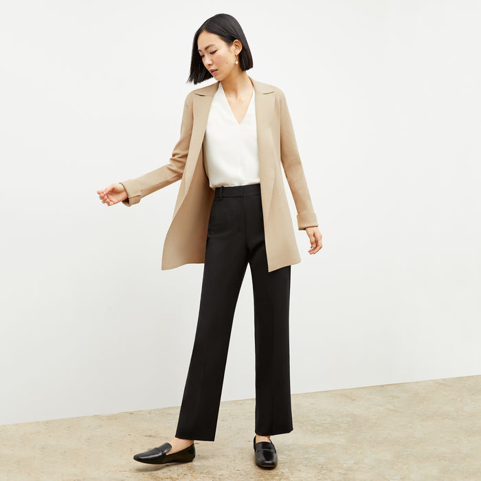 Front image of a woman wearing the smith pant in black