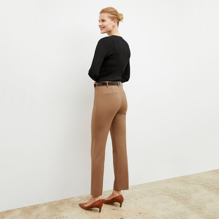 Back image of a woman wearing the smith in camel
