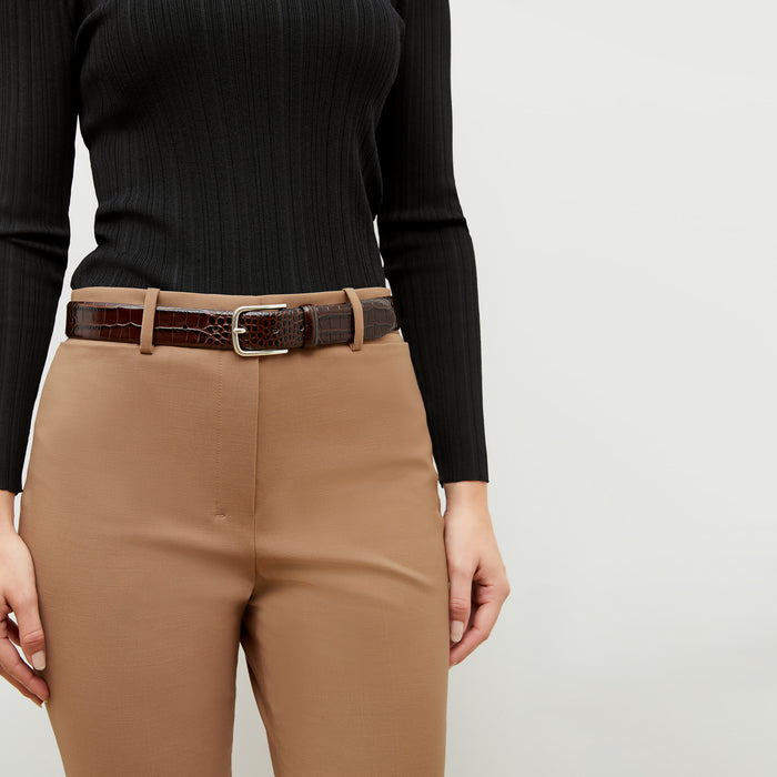 Front image of a woman wearing the smith in camel