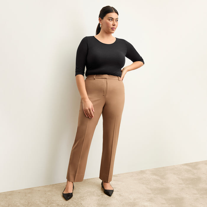 Front image of a woman wearing the smith in camel