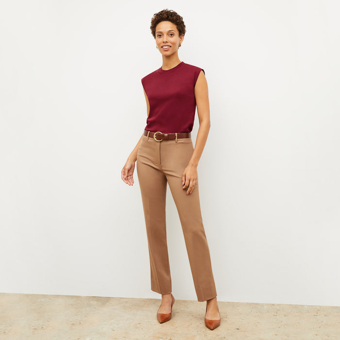 Front image of a woman wearing the smith in camel
