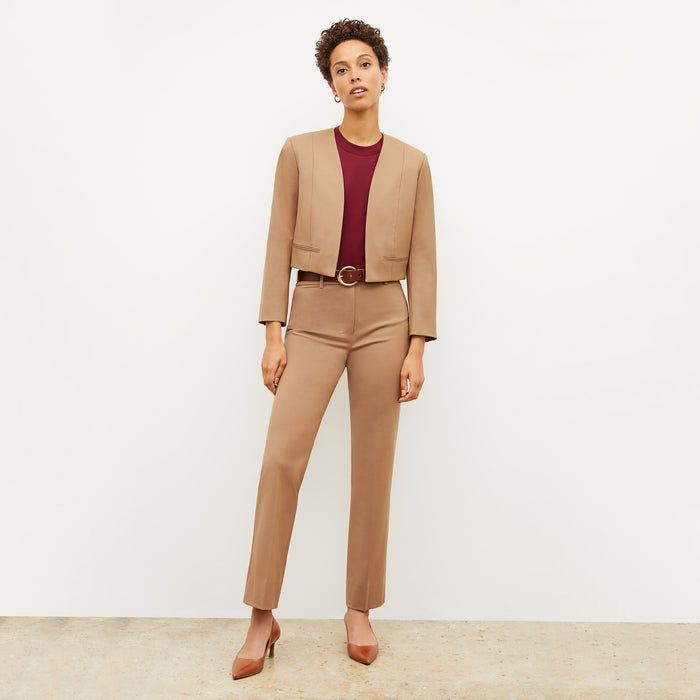 Front image of a woman wearing the smith in camel