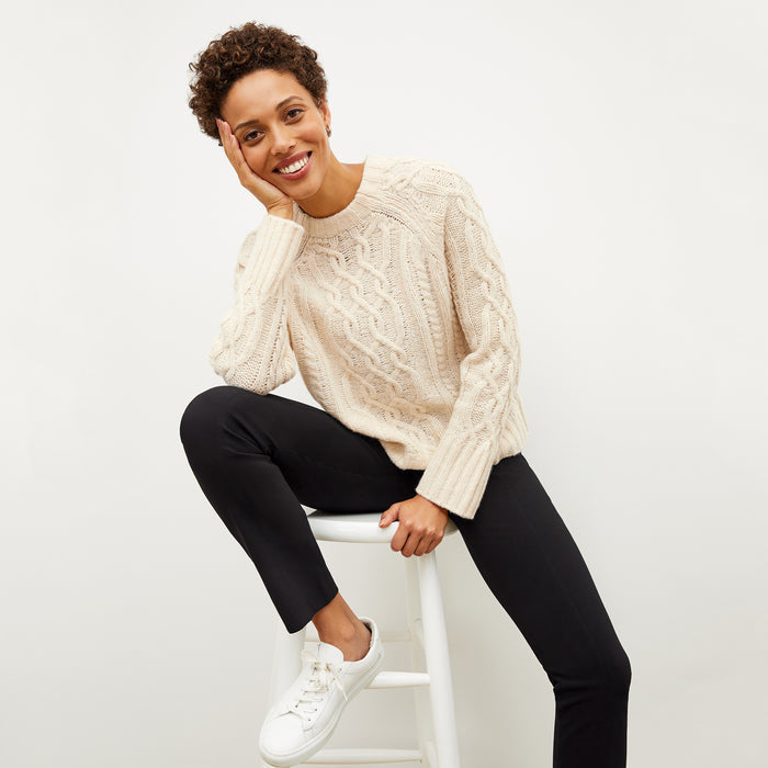 Image of a woman wearing the somers sweater in ivory | Lead