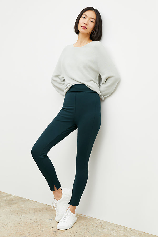 Front image of a woman wearing the Stella Legging in Deep Sea | Grid | Exclude