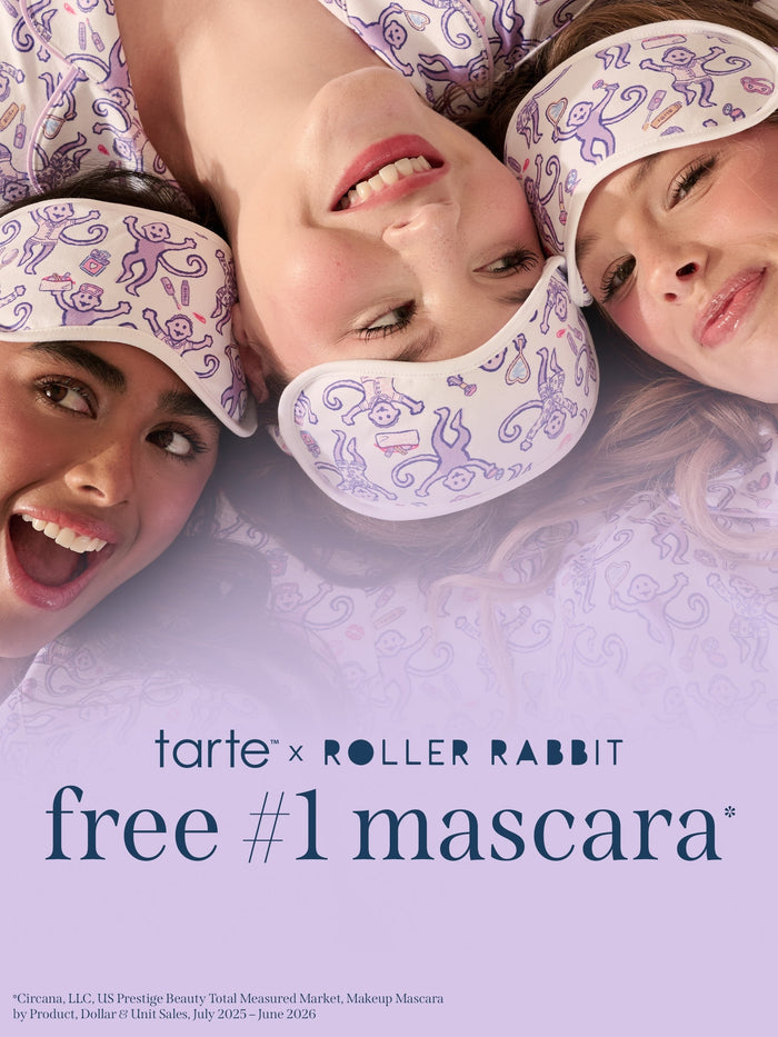 Three women lying down wearing white roller rabbit eye masks with purple swirl patterns, with text at the bottom reading 'tarte x ROLLER RABBIT free #1 mascara'.