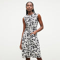 front image of a woman wearing the taylor dress in icon print | Lead