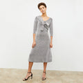 Front image of a woman wearing the Tippy Dress in Brick and Black | Lead