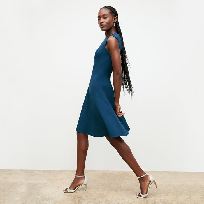 side image of a woman wearing the toi dress deep teal