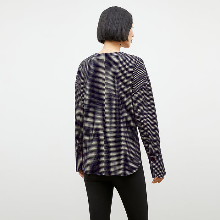 Back image of a woman wearing the tully top in black and white