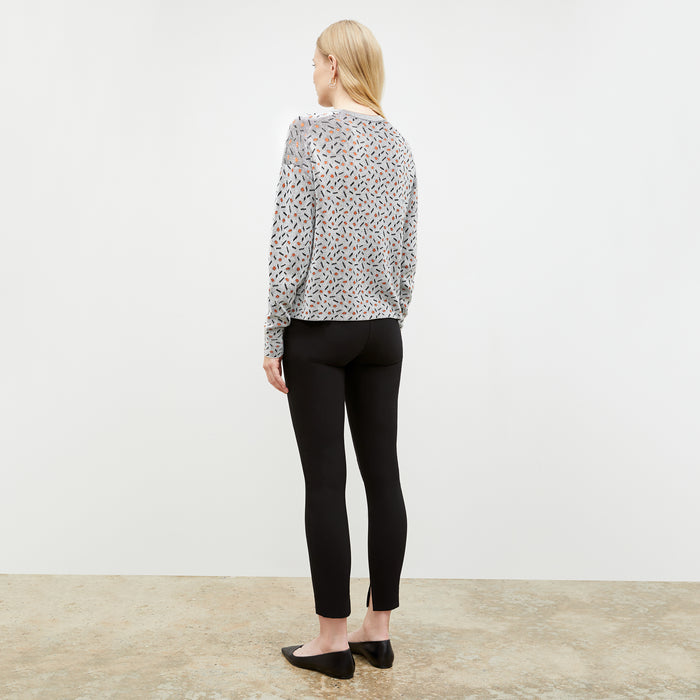 Back image of a woman wearing the Tyler Sweatshirt in Brick and Black
