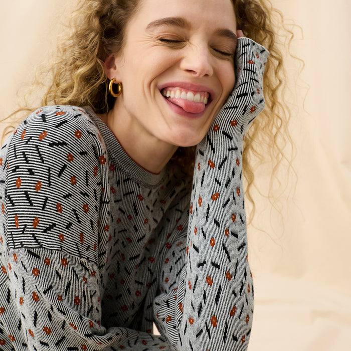 Front image of a woman wearing the Tyler Sweatshirt in Brick and Black