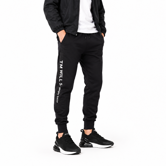 Men's studio styling with black Unisex Max Air running shoes on a clean white background.