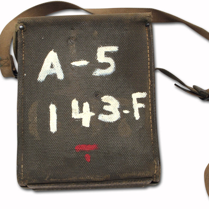 military surplus US Army Field Phone in canvas satchel with original markings and shoulder strap