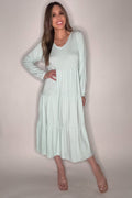 Pastel blue V-neck tiered long sleeve maxi dress with a flowing full-length silhouette.