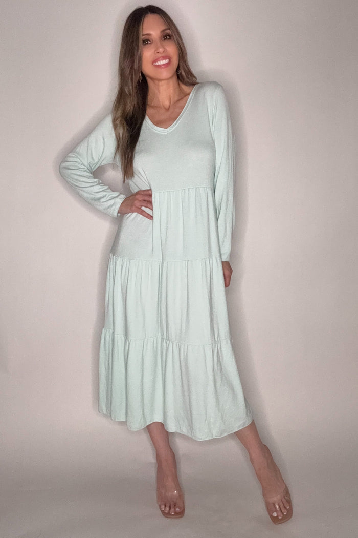 Pastel blue V-neck tiered long sleeve maxi dress with a flowing full-length silhouette.