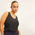 Front image of a woman wearing the Vicky Tank in Black | Lead