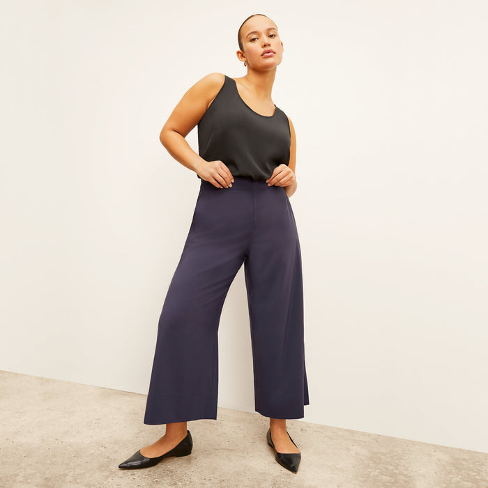 Front image of a woman wearing the Vicky Tank in Black