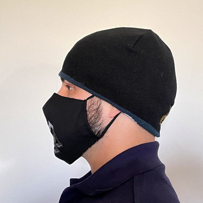 Side view of Black Cotton Face Mask with silk embroidered Viking Valknut, adjustable straps and pocket for disposable filter