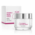 Close-up professional packshot of Vitamin C Facial Cream 30g jar, clear base, silver lid and matching white carton.