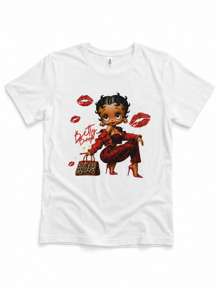 White graphic tee featuring a bold Betty Boop design surrounded by red lipstick kiss prints.
