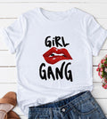 White short sleeve graphic tee with bold red lips and black Girl Gang lettering, styled with denim shorts.