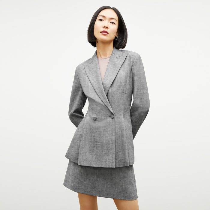 Front image of a woman wearing the Whitney Skirt in Black / White