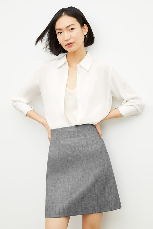 Front image of a woman wearing the Whitney Skirt in Black / White | Grid | Exclude