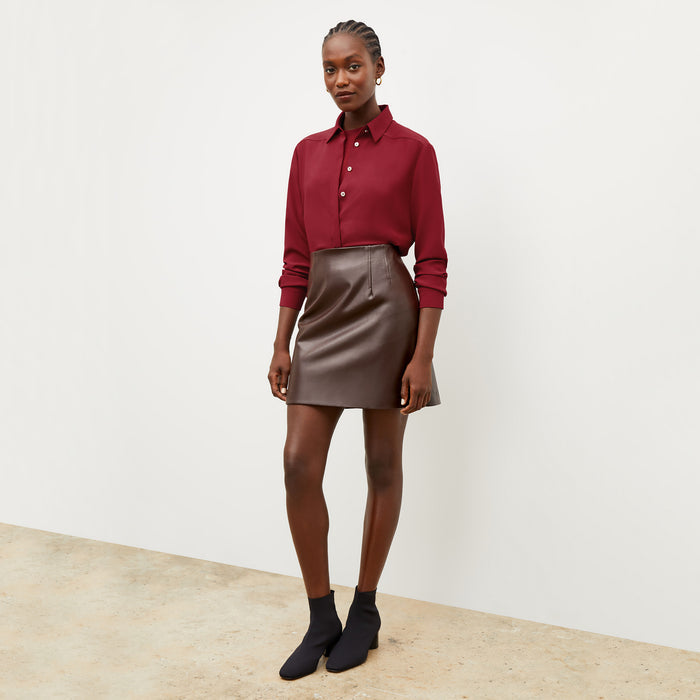 Front image of a woman wearing the Whitney Skirt in Brown