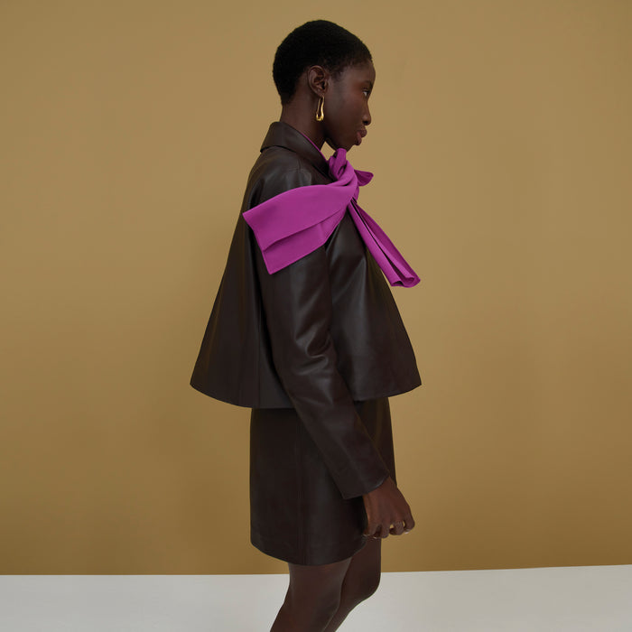 Side image of a woman wearing the Whitney Skirt in Brown