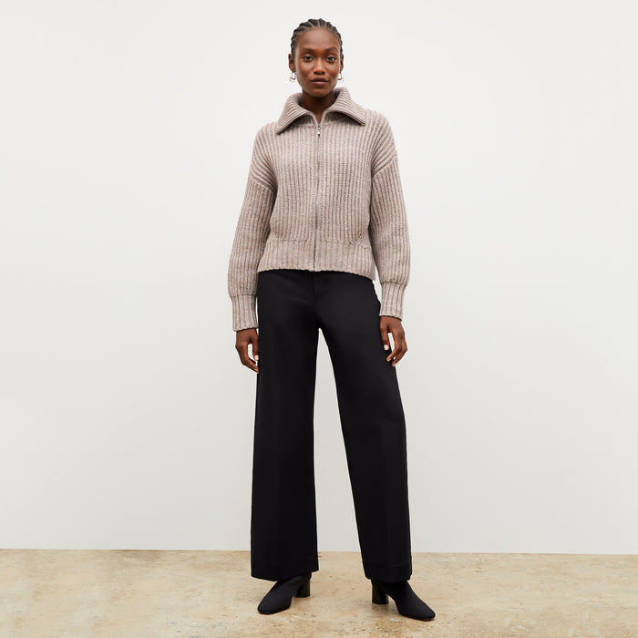 Front image of a woman wearing the william sweater in barley